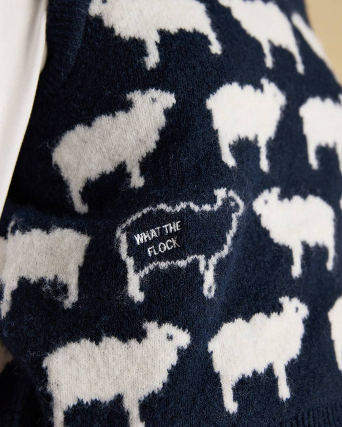 Navy coloured Joules Womens What The Flock Intarsia Knitted Vest on wall background #colour_navy