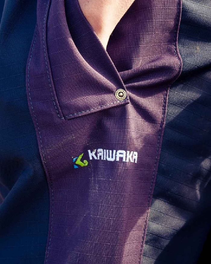 Navy coloured Kaiwaka Womens Stormforce Overtrouser on blurry background #colour_navy