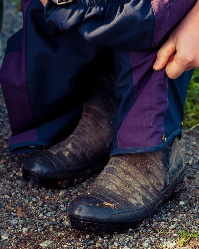 Navy coloured Kaiwaka Womens Stormforce Overtrouser on soil background #colour_navy