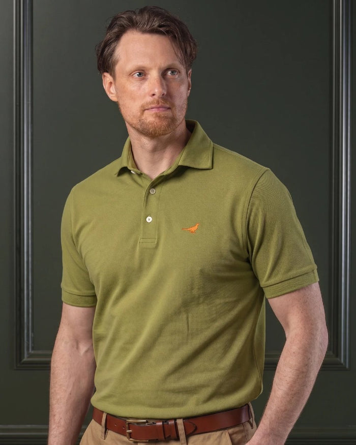 Olive coloured Laksen Mens Amalfi Polo T-Shirt on wall background #colour_olive