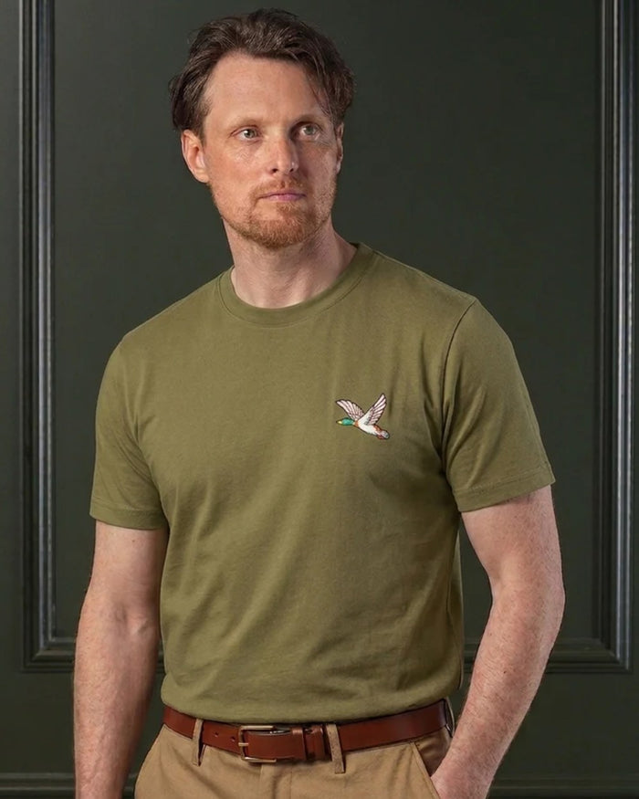 Olive coloured Laksen Mens Duck Cotton T-Shirt on wall background #colour_olive