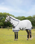 White coloured LeMieux Arika Field Rug on farm background #colour_white