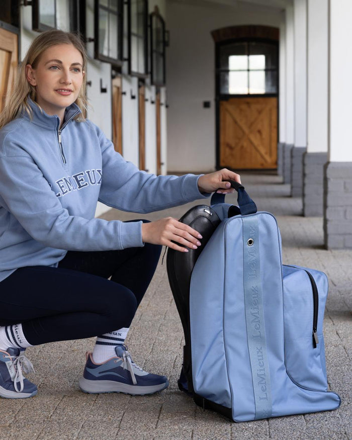 Powder Blue coloured LeMieux Boot & Hat Bag on outdoor background #colour_powder-blue