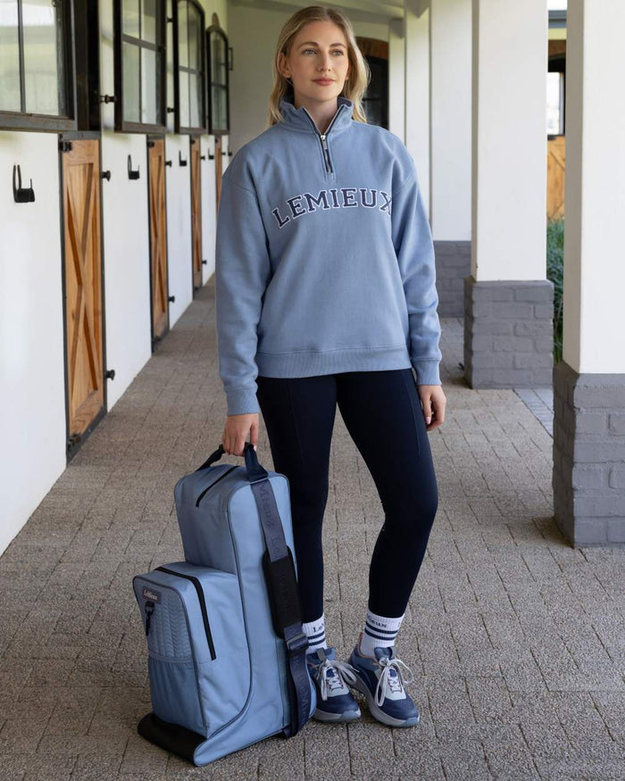 Powder Blue coloured LeMieux Boot & Hat Bag on outdoor background #colour_powder-blue