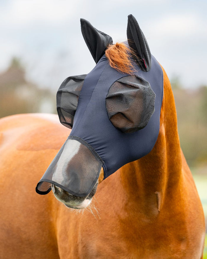 Navy coloured LeMieux Bug Relief Full Mask on blurry background #colour_navy