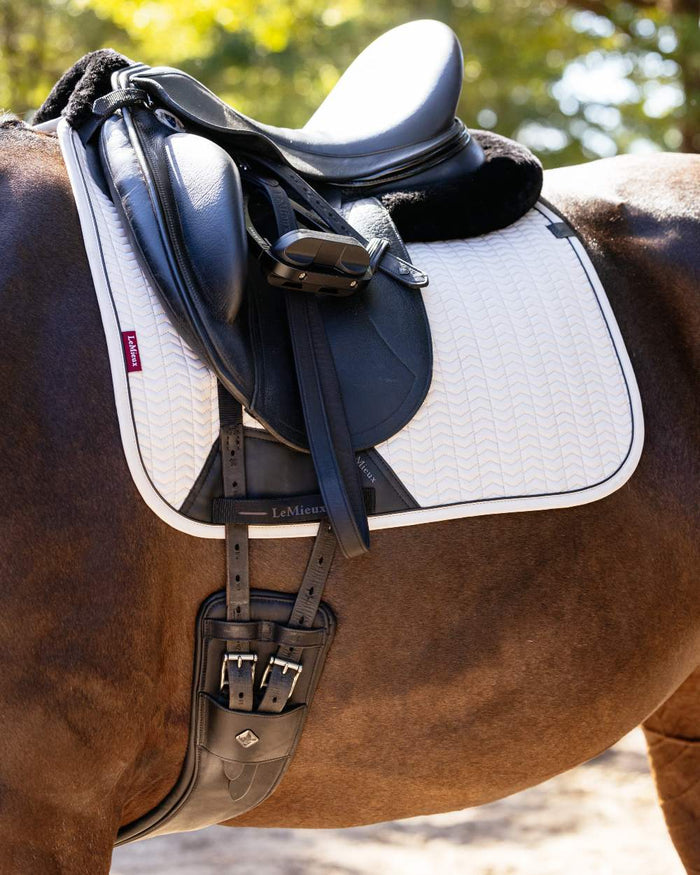 Stone coloured LeMieux Finesse Dressage Square on blurry background #colour_stone