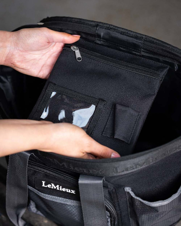 Black coloured LeMieux Grooming Bag on blurry background #colour_black