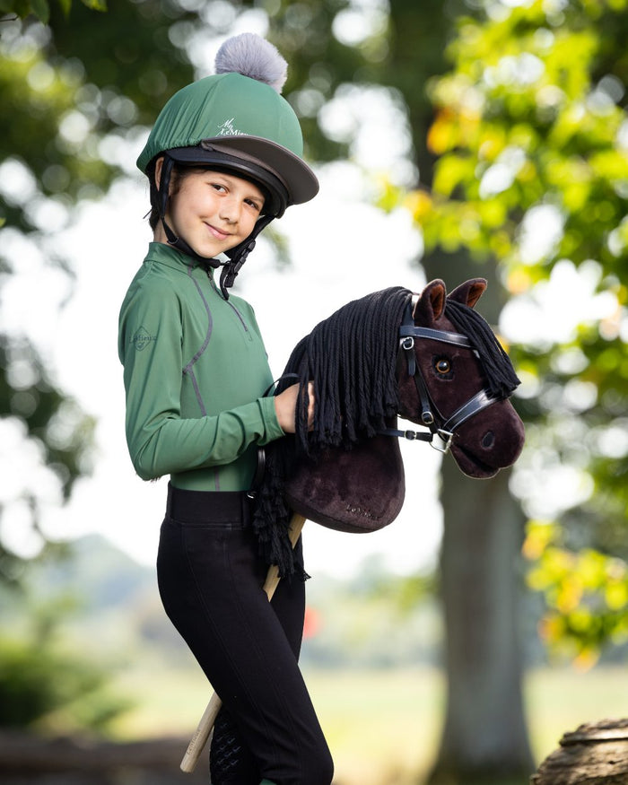 Freya Coloured LeMieux Hobby Horse On A Outer Yard Background #colour_freya