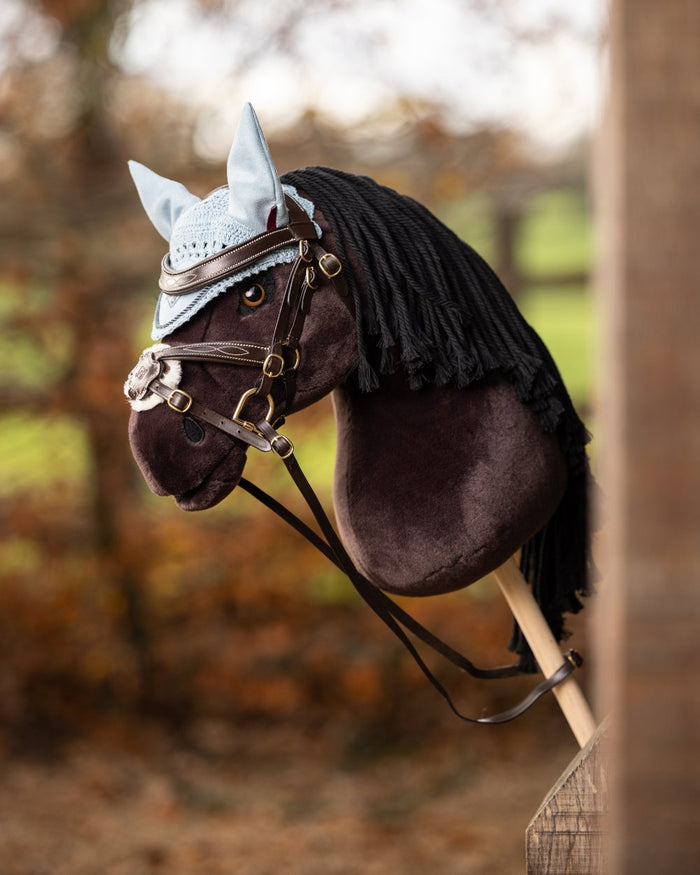 Freya Coloured LeMieux Hobby Horse On A Outer Yard Background #colour_freya