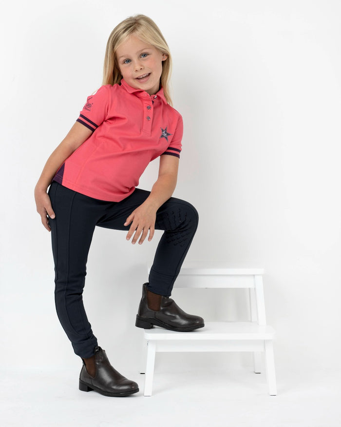 Black coloured LeMieux Junior Pro Breeches on grey background #colour_black
