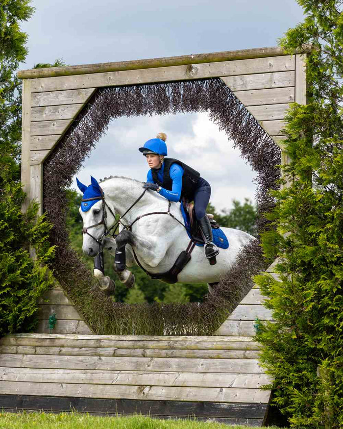 Benetton Coloured LeMieux Loire Close Contact Square On A Riding Arena Background #colour_benetton
