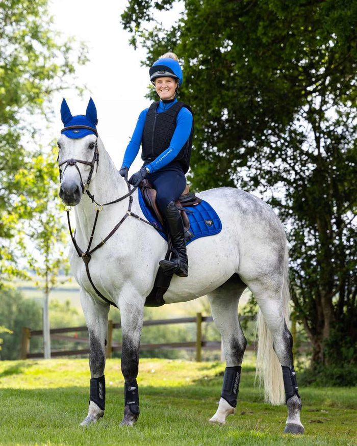 Benetton Coloured LeMieux Loire Close Contact Square On A Riding Arena Background #colour_benetton