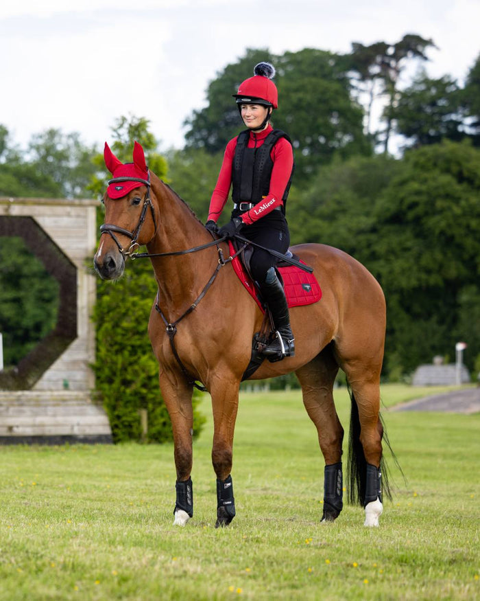 Chilli Coloured LeMieux Loire Close Contact Square On A Riding Arena Background #colour_chilli