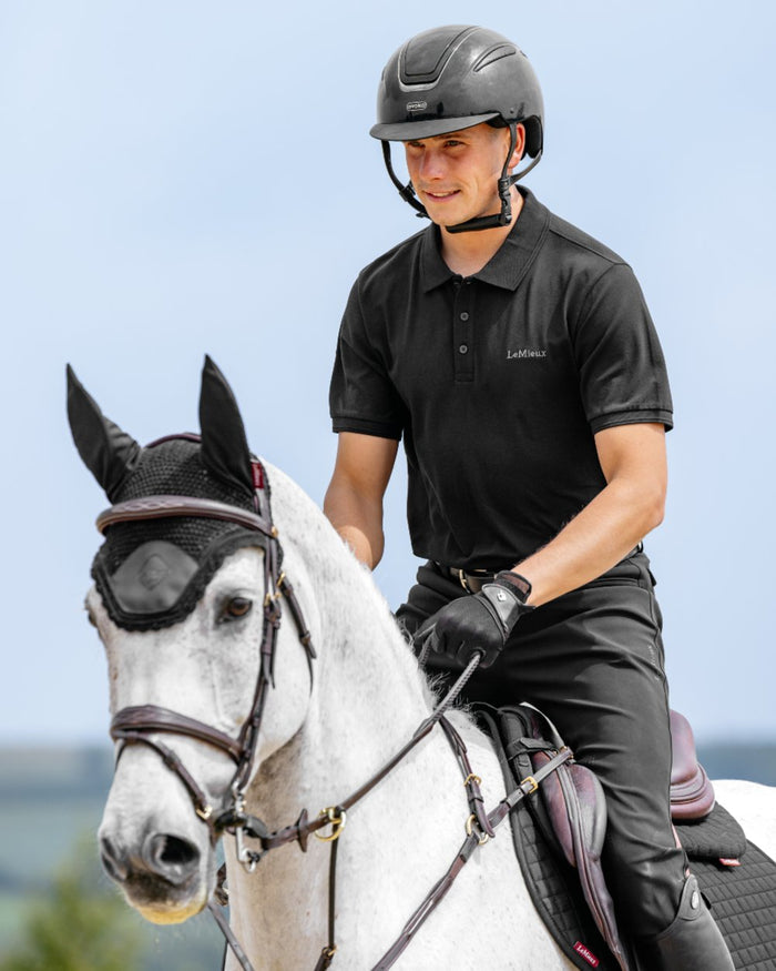 Black coloured LeMieux Mens Classique Polo T-Shirt on sky background #colour_black
