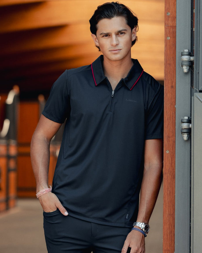 Navy coloured LeMieux Mens Performance Polo T-Shirt on outdoor background #colour_navy
