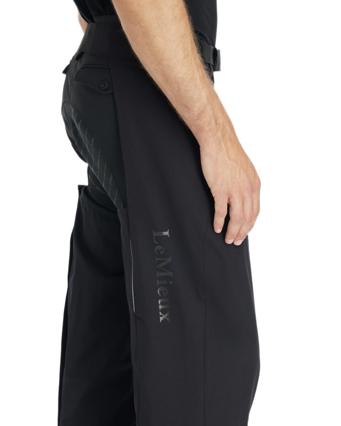 Black coloured LeMieux Mens Stormwear Waterproof Chaps on white background #colour_black