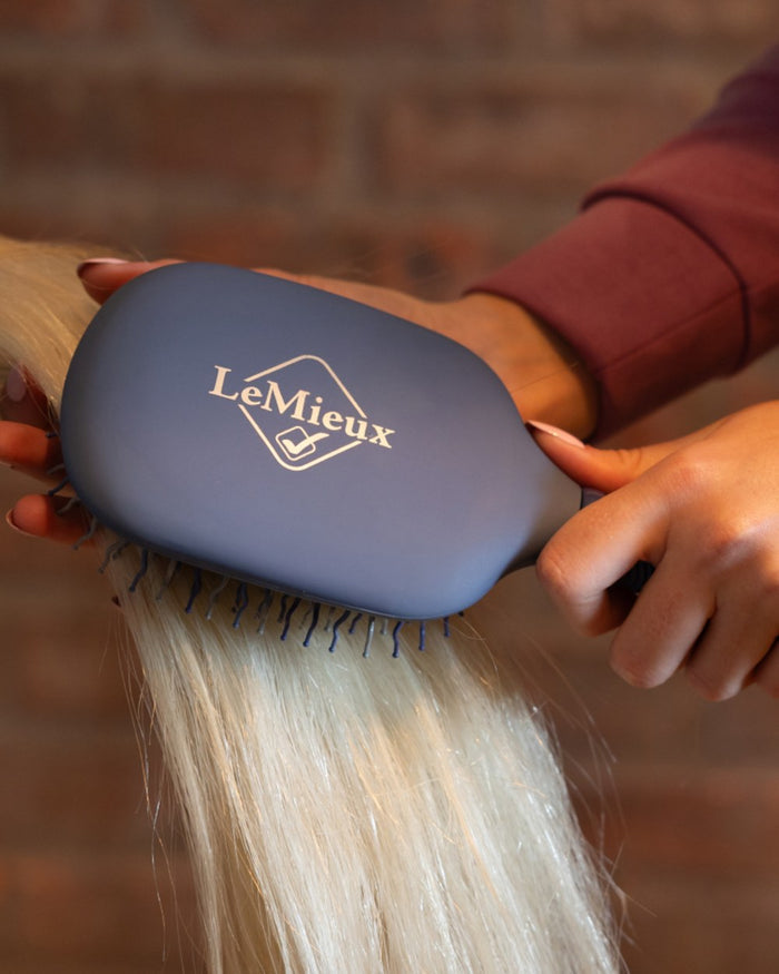 Powder Blue coloured LeMieux Tangle Tidy Brush on outdoor background #colour_powder-blue