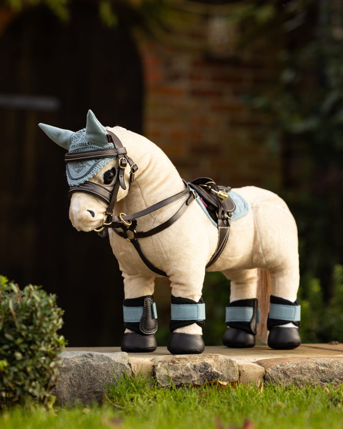 Glacier Coloured LeMieux Toy Pony Grafter Boots On A Outer Yard Background #colour_glacier