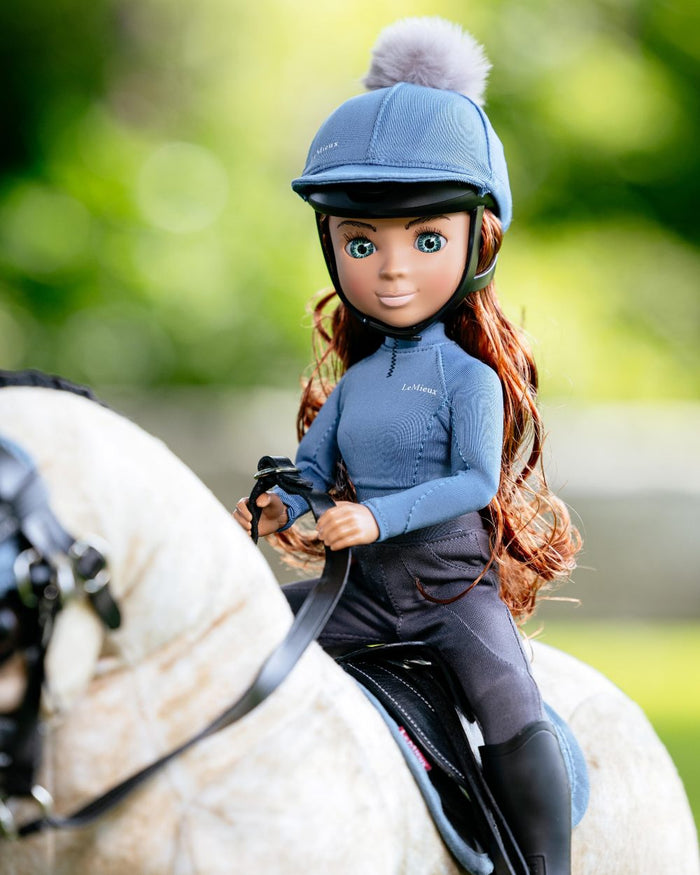 Ice Blue Coloured LeMieux Toy Rider Outfit on outdoor background #colour_ice-blue