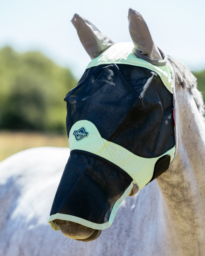 Macaron coloured LeMieux Visor Tek Full Fly Mask on outdoor background #colour_macaron