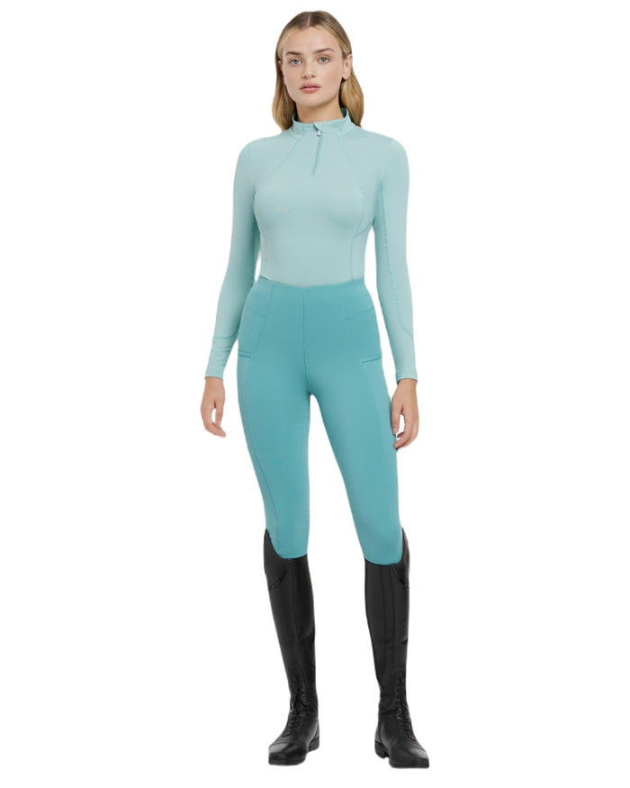 Aqua coloured LeMieux Womens Base Layer on white background #colour_aqua