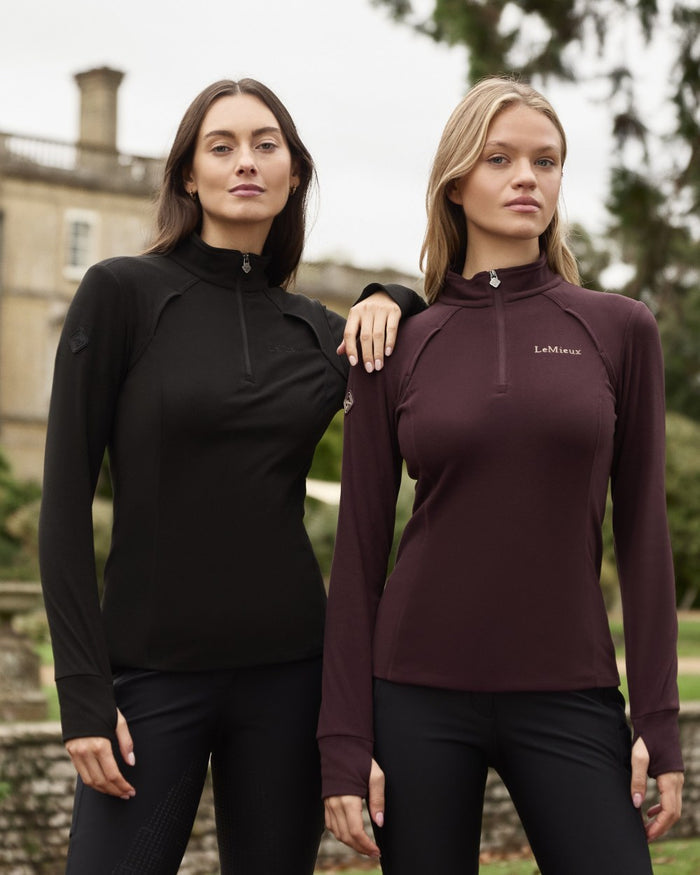 Black coloured LeMieux Frances Quarter Zip Fleece on outdoor background #colour_black