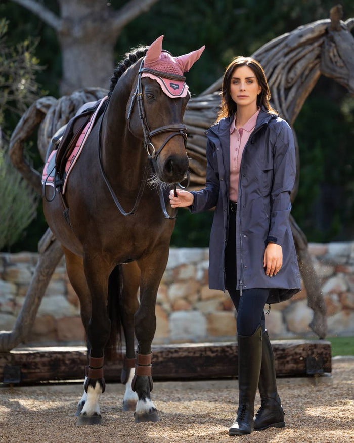 Dusk Blue coloured LeMieux Womens Grace Long Rain Jacket on lawn background #colour_dusk-blue