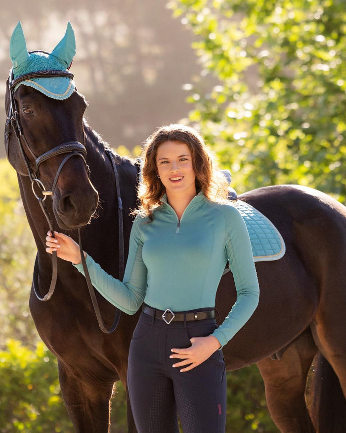 Lagoon coloured LeMieux Womens Halle Lightweight Base Layer on street background #colour_lagoon