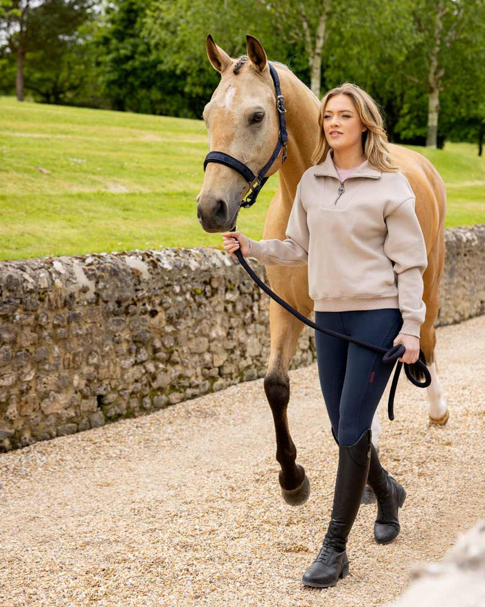 Almond coloured LeMieux Womens Keira Quarter Neck Sweatshirt on street background #colour_almond