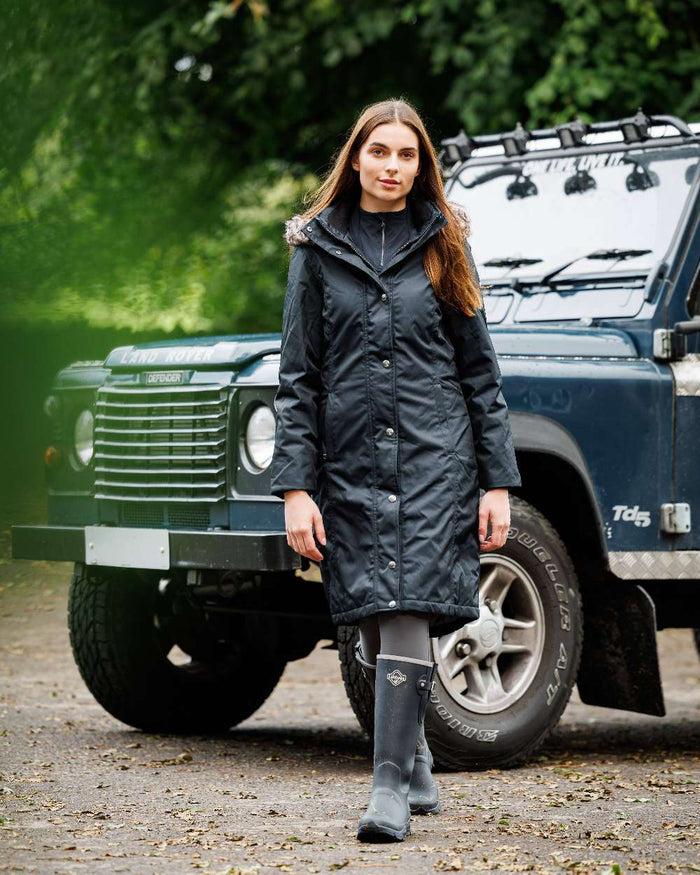 Navy Coloured LeMieux Womens Ultra Stride Wellington Boots on car background #colour_navy