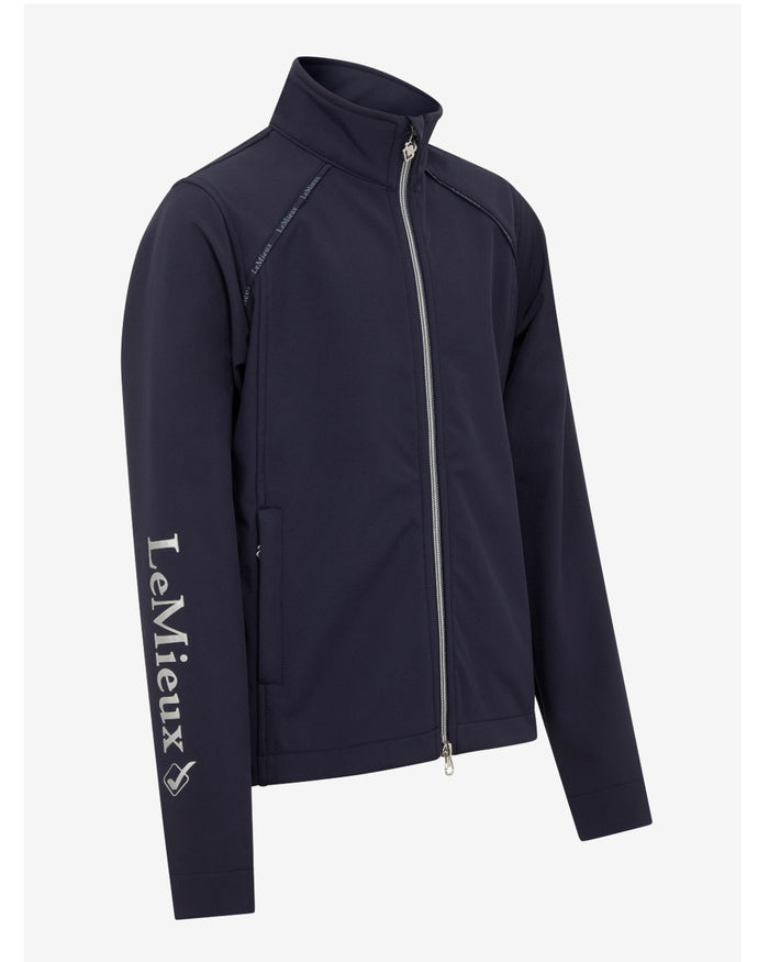 Navy coloured LeMieux Young Rider Elite Soft Shell Jacket on grey background #colour_navy