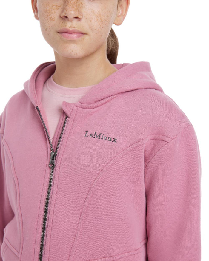 Peony coloured LeMieux Young Rider Hadley Hoodie on white background #colour_peony