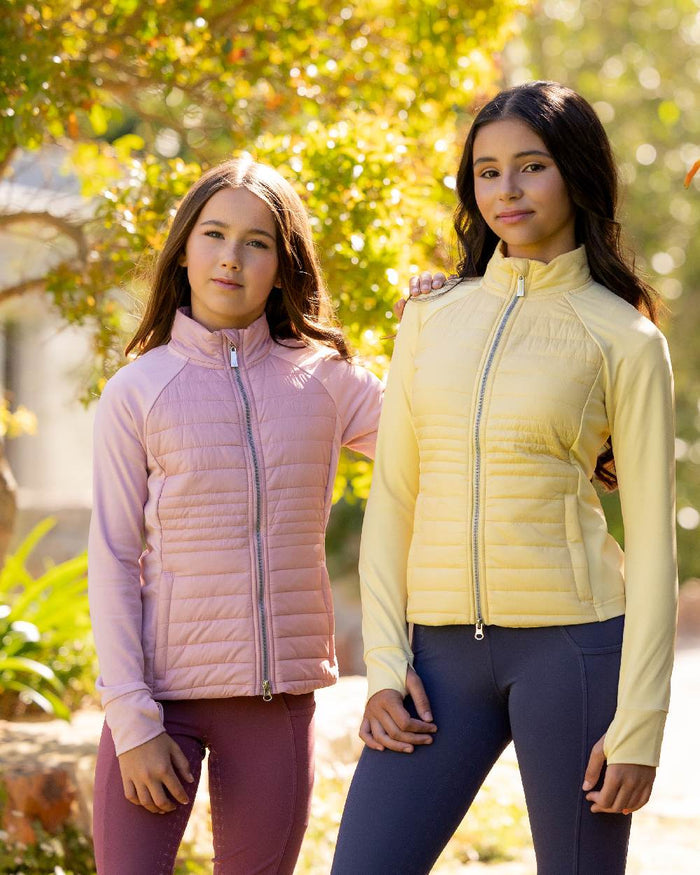 Blossom coloured LeMieux Young Rider Josephine Jacket on backyard background #colour_blossom