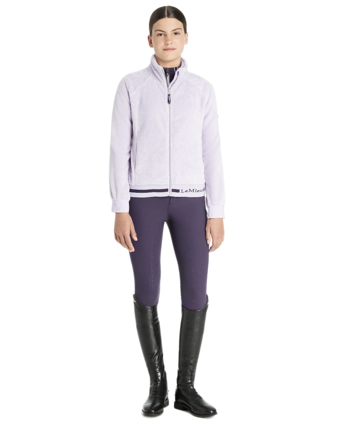 Lilac Coloured LeMieux Young Rider Libby Fleece Jacket On A White Background #colour_lilac