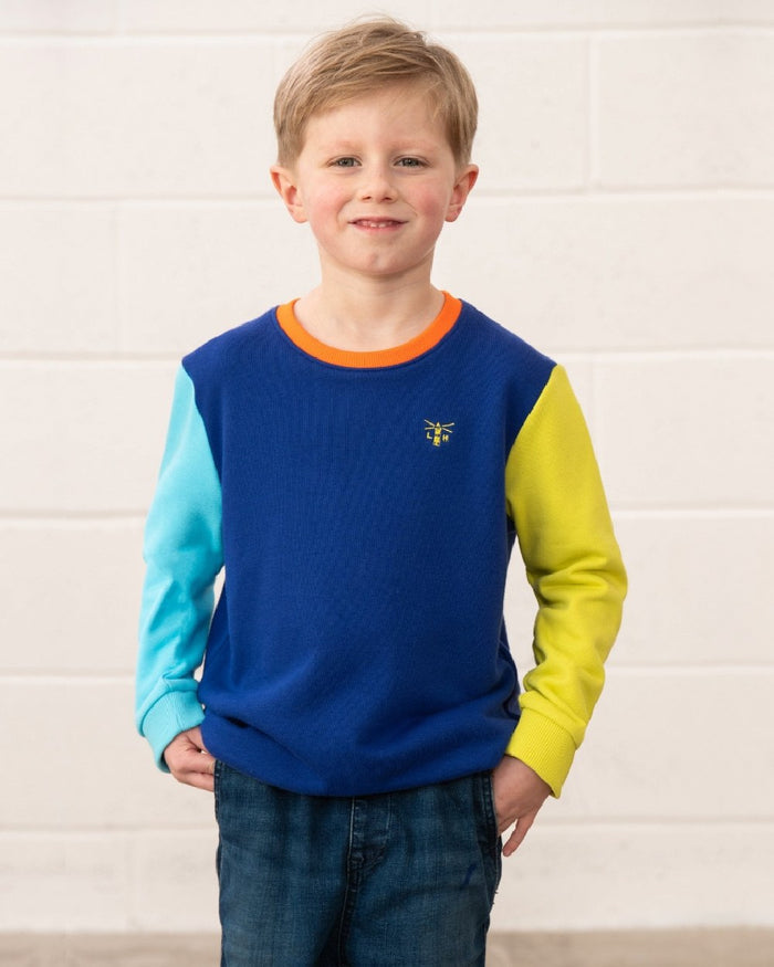 Blue Navy Lime coloured Lighthouse Childrens Finn Jersey on wall background #colour_blue-navy-lime