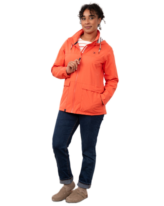 Coral coloured Lighthouse Ladies Beachcomber II Coat on white background #colour_coral