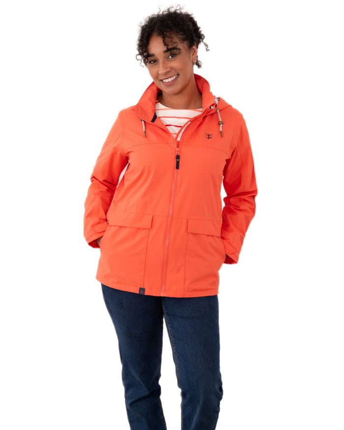 Coral coloured Lighthouse Ladies Beachcomber II Coat on white background #colour_coral
