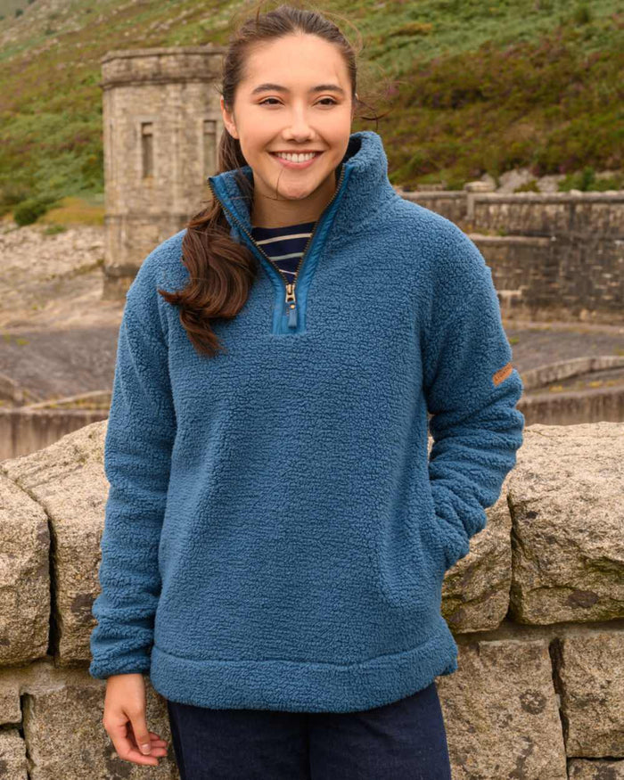 Teal coloured Lighthouse Ladies Coast Half Zip Fleece Sweater on outdoor background #colour_teal