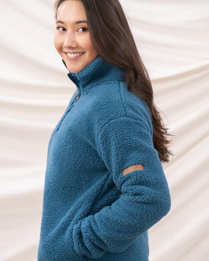 Teal coloured Lighthouse Ladies Coast Half Zip Fleece Sweater on curtain background #colour_teal