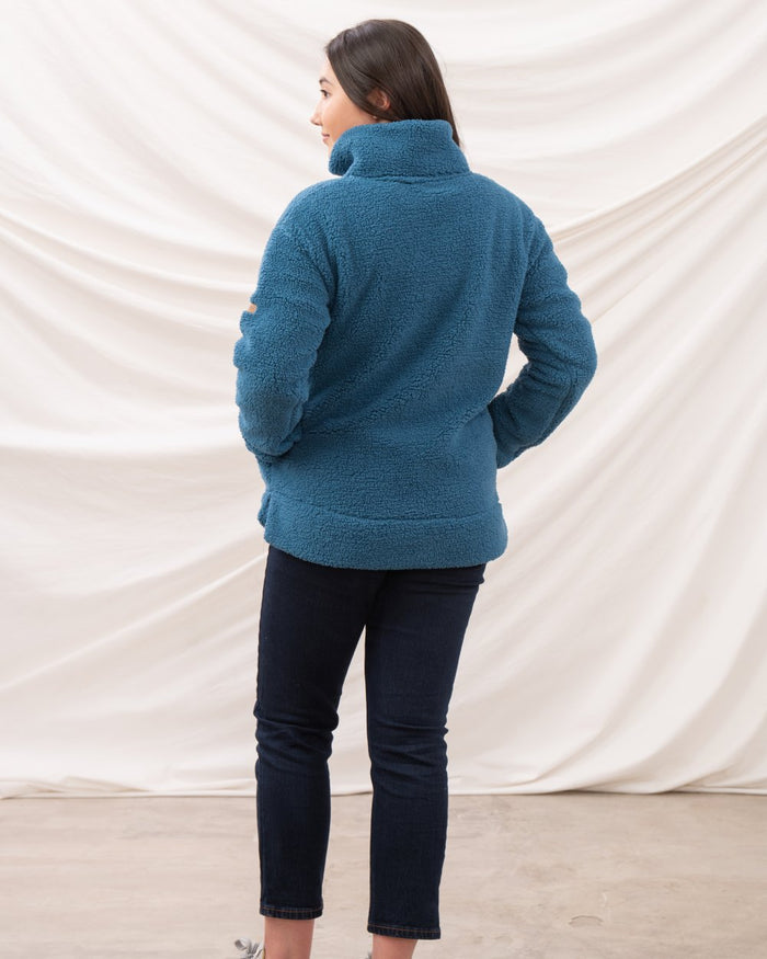 Teal coloured Lighthouse Ladies Coast Half Zip Fleece Sweater on curtain background #colour_teal