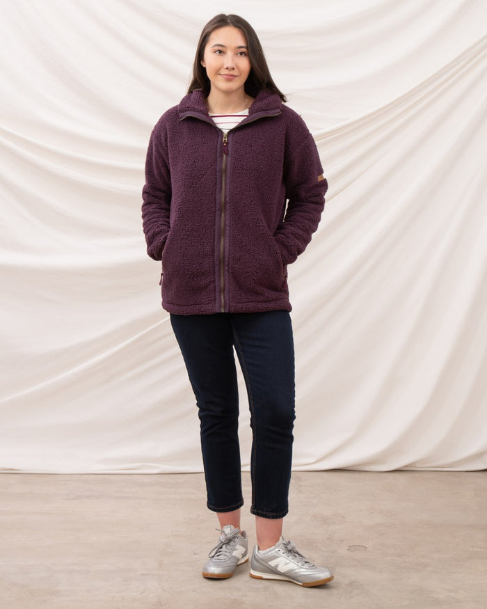 Cranberry coloured Lighthouse Ladies Cobh Full Zip Fleece Jacket on curtain background #colour_cranberry