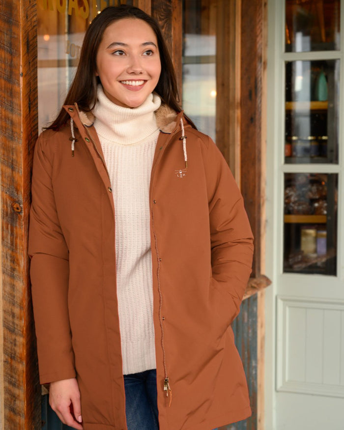 Rust coloured Lighthouse Ladies Scarlet Coat on house background #colour_rust