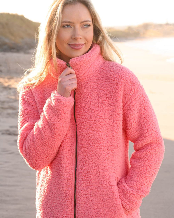 Sugar Coral coloured Lighthouse Ladies Seashell Full Zip Sherpa Fleece on blurry background #colour_sugar-coral