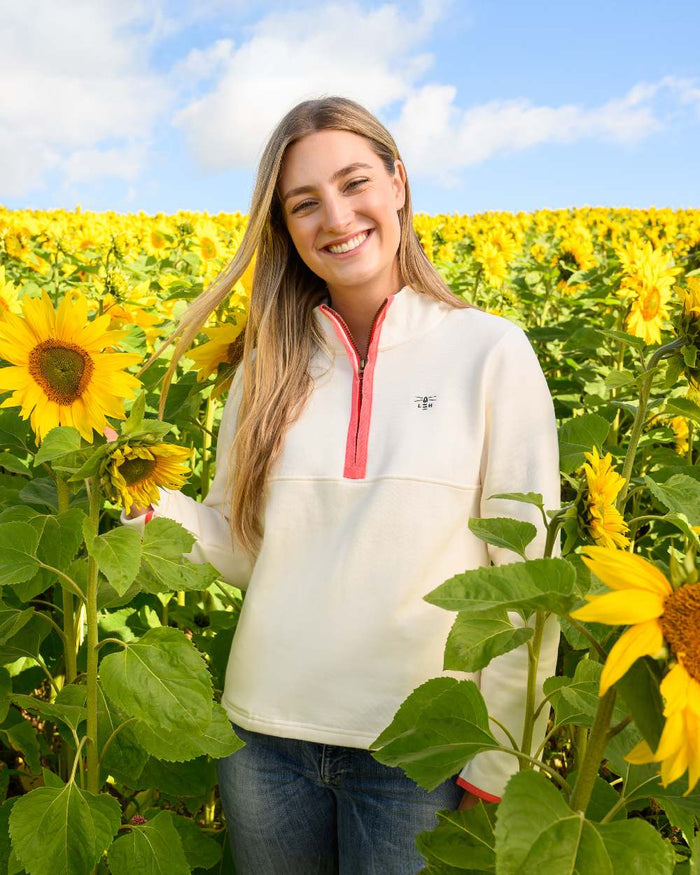 Coconut coloured Lighthouse Ladies Shore Sweatshirt on sunflower field background #colour_coconut