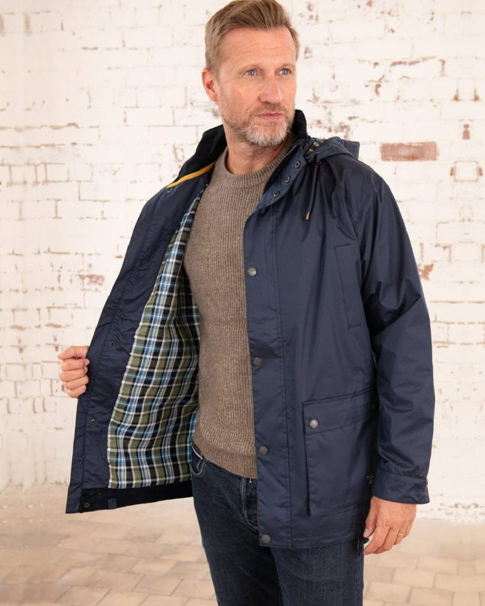 Navy coloured Lighthouse Mens Oxford Raincoat on wall background #colour_navy