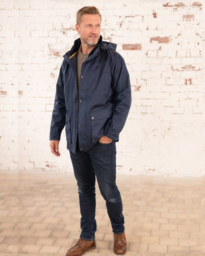 Navy coloured Lighthouse Mens Oxford Raincoat on wall background #colour_navy