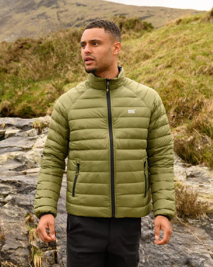 Khaki Black coloured Mac In A Sac Packable Mens Polar Down Jacket on blurry green background #colour_khaki-black