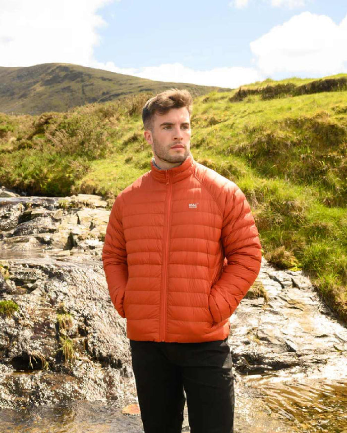 Burnt Orange Grey coloured Mac In A Sac Packable Mens Polar Down Jacket on mountain background #colour_burnt-orange-grey