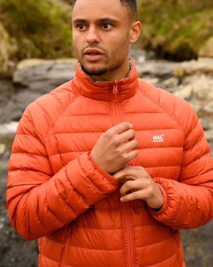 Burnt Orange Grey coloured Mac In A Sac Packable Mens Polar Down Jacket on blurry background #colour_burnt-orange-grey