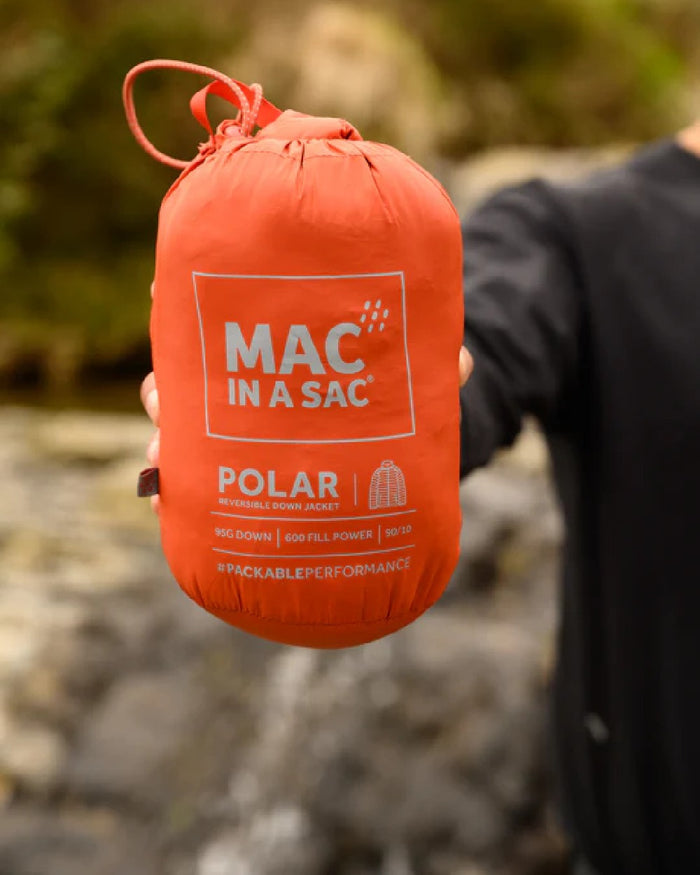 Burnt Orange Grey coloured Mac In A Sac Packable Mens Polar Down Jacket on blurry background #colour_burnt-orange-grey
